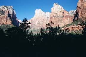 Sunlit peaks on canyon wall
